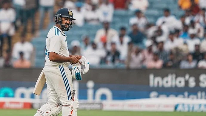 A distraught Rohit Sharma walks back after his dismissal in Pune