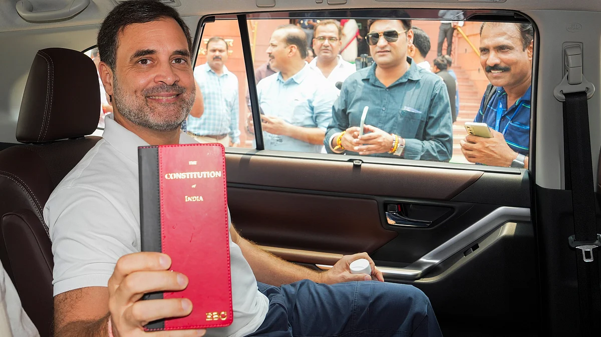 Rahul Gandhi holds up a copy of the Indian Constitution