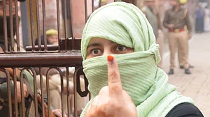 UP by-polls: SP says cops deterring voters, BJP wants identity check on burqa-clad women