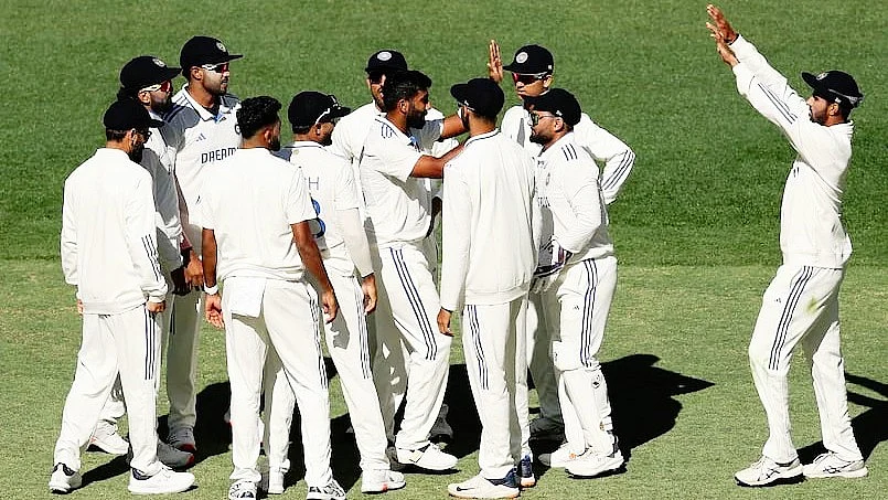Jasprit Bumrah (centre) congratulated by teammates after one of his wickets at Perth