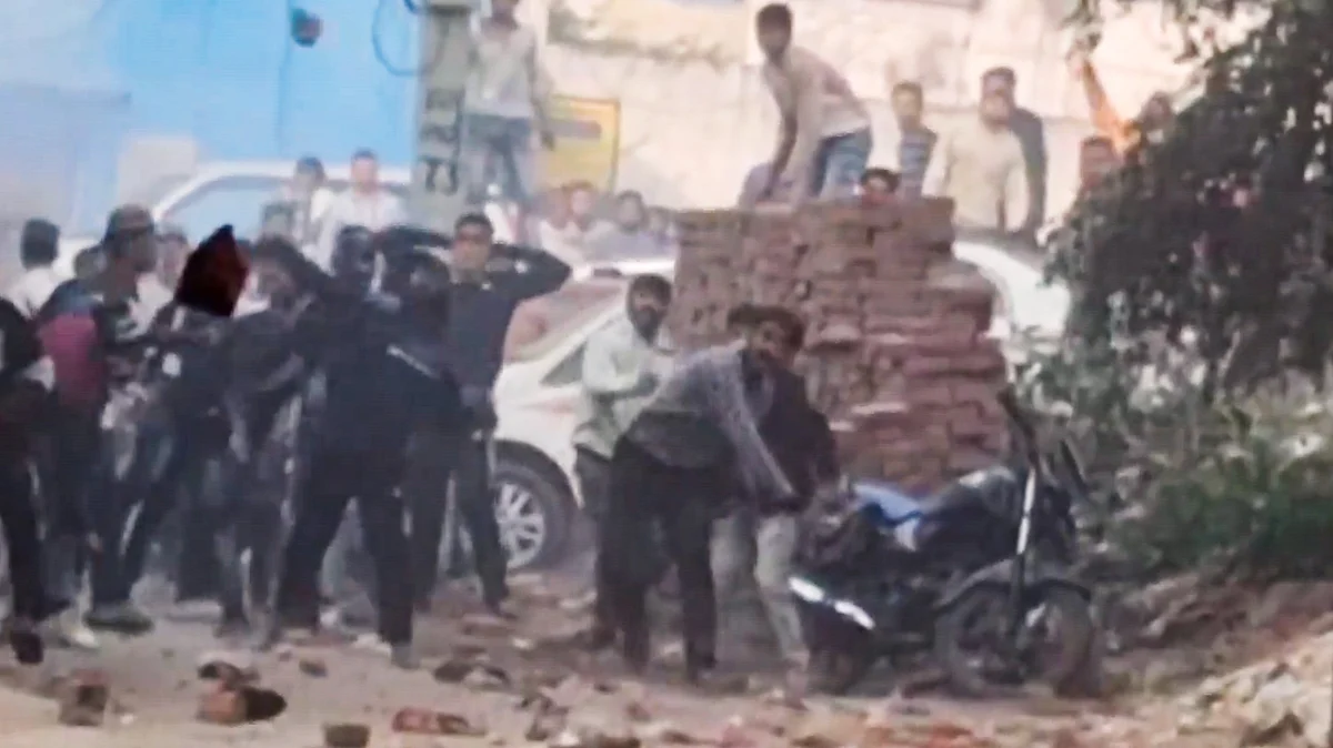 Locals pelt stones in Sambhal on 24 November (photo: PTI)