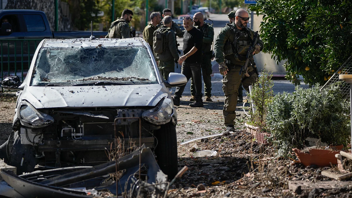Israeli security officers inspect a site in northern Israel on 26 November (photo: PTI)