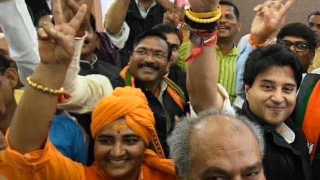 Sadhvi Pragya Singh Thakur (in saffron) in a jubilant mood, flashing a 'V' alongside BJP colleagues 