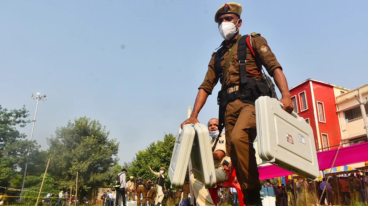 File photo of a security personnel carrying EVMs