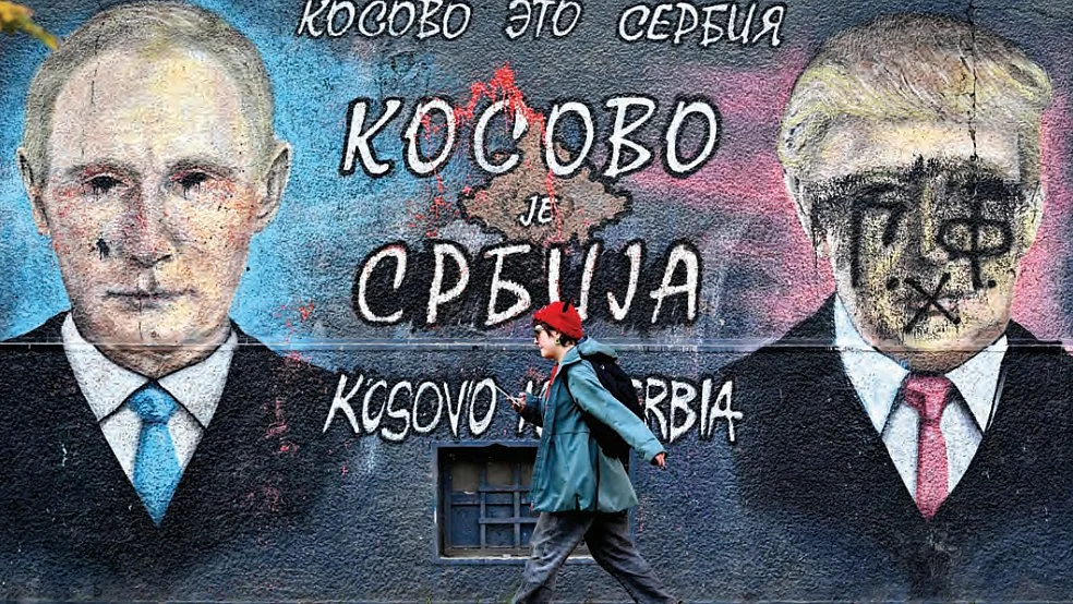 Belgrade: vandalised portraits of Russian President Vladimir Putin and Donald Trump