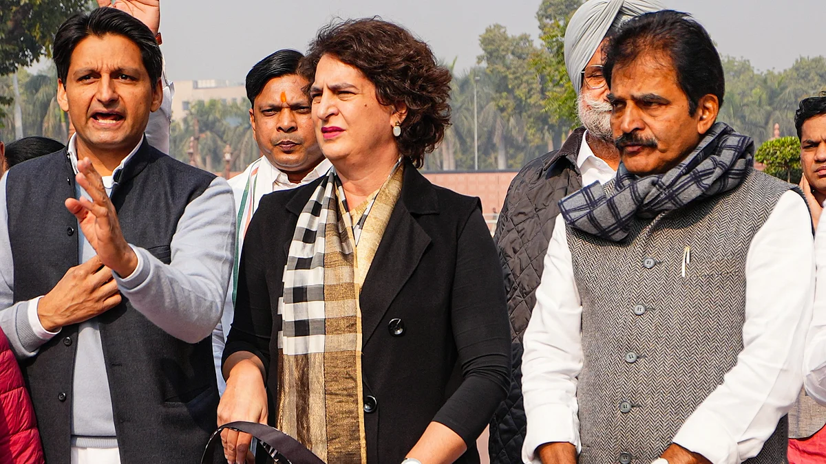 K.C. Venugopal with Priyanka Gandhi Vadra outside Parliament (photo: PTI)