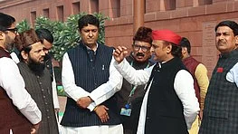 SP supremo Akhilesh Yadav with other leader in Parliament (photo: IANS)