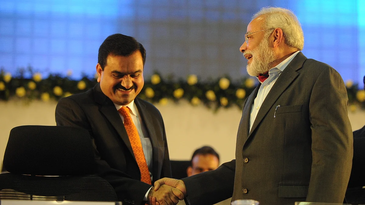 Gautam Adani (left) and Narendra Modi (photo: @NarundarM/X)