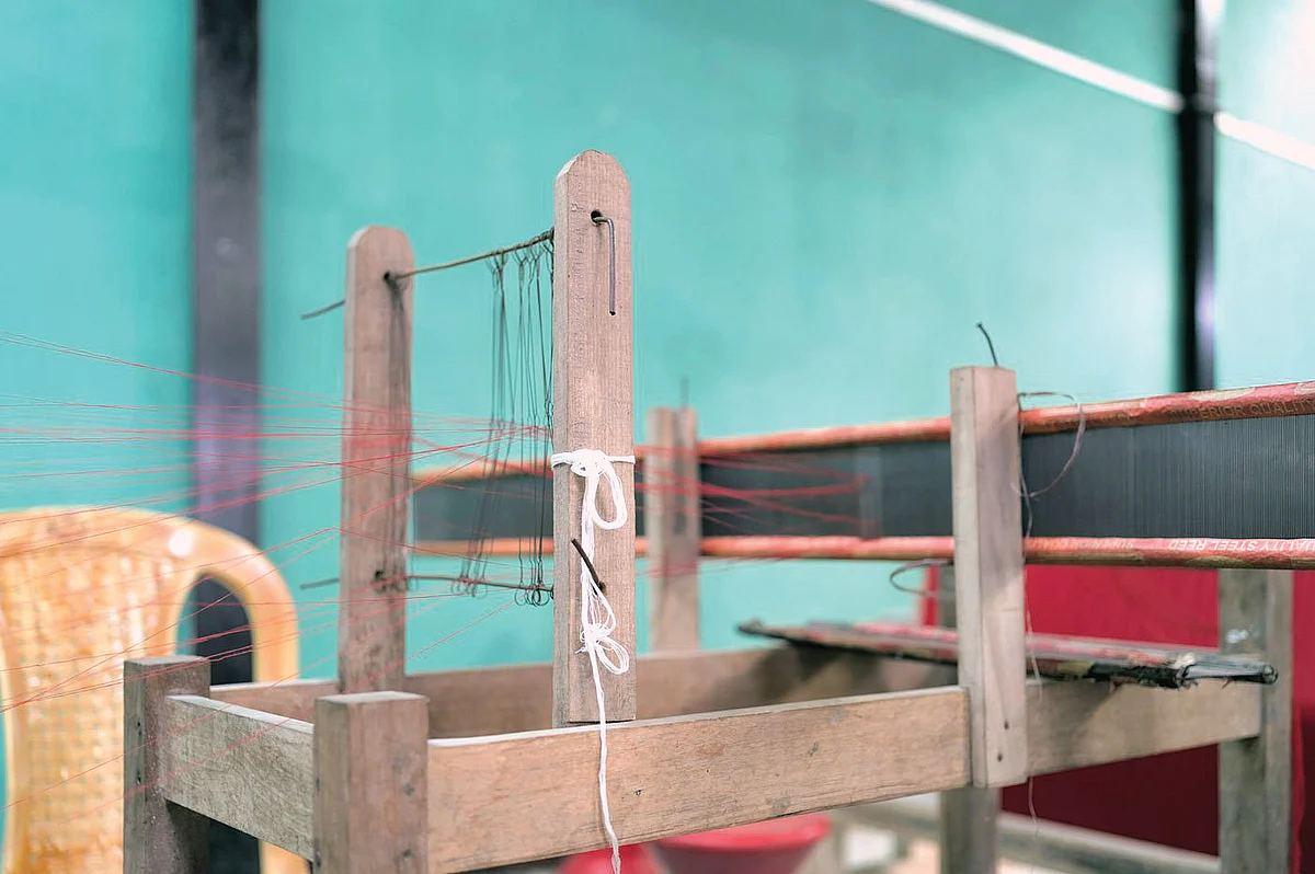 The handloom frame Jamini Payeng works on