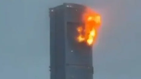 A residential building on fire after drone attack (photo: IANS)