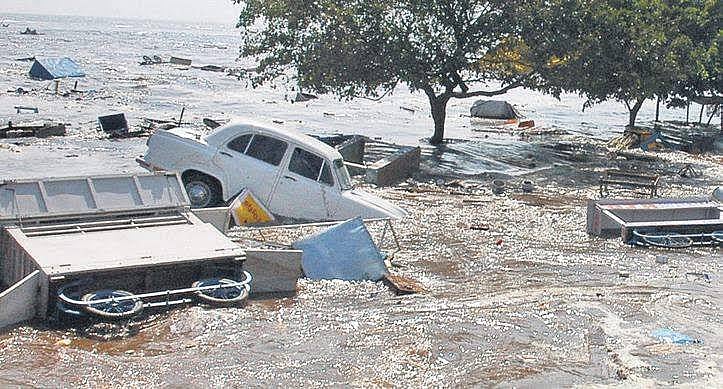 Cars submerged in sand turned to sludge, concrete blocks overturned in the 2004 Boxing Day tsunami that hit the Tamil Nadu coast