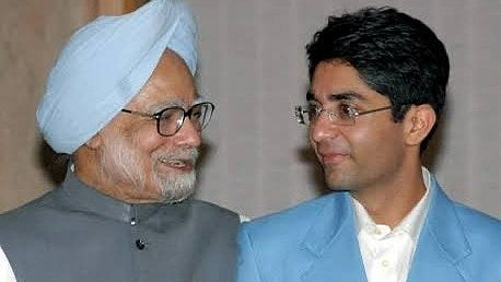 'Humility, wisdom, quiet strength': Abhinav Bindra (right) saw a role model in Manmohan Singh (L)