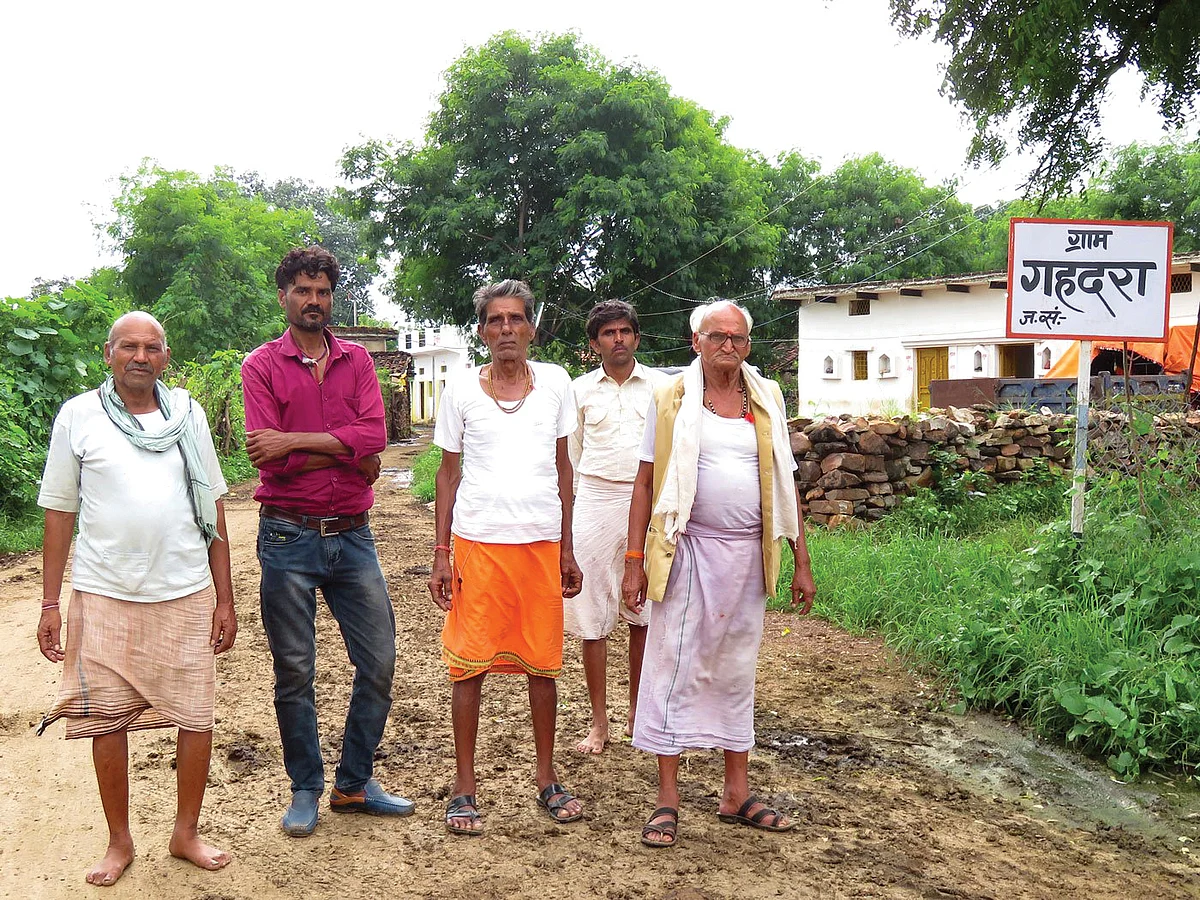 From left: Paramalal, Sudama Prasad, Sharad Prasad, Birendra Pathak and
Swami Prasad Parohar of Gahdara village say they have no idea when the full and final settlement will come