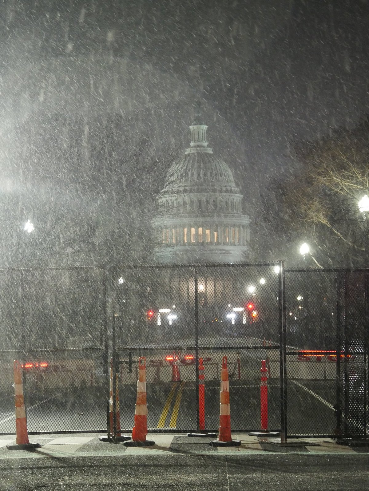 Heavy snowfall reduces visibility around the US Capitol, with 4-8 inches expected from winter storm Blair. Hazardous travel conditions and plummeting temperatures forecasted.