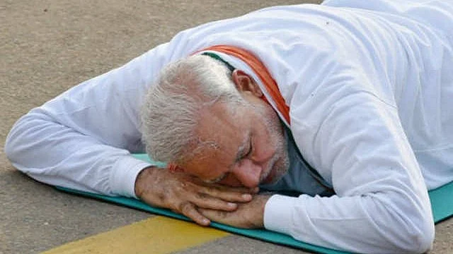 PM Narendra Modi seems ready to beat the slumping GDP, here in a variation of sithilasana
