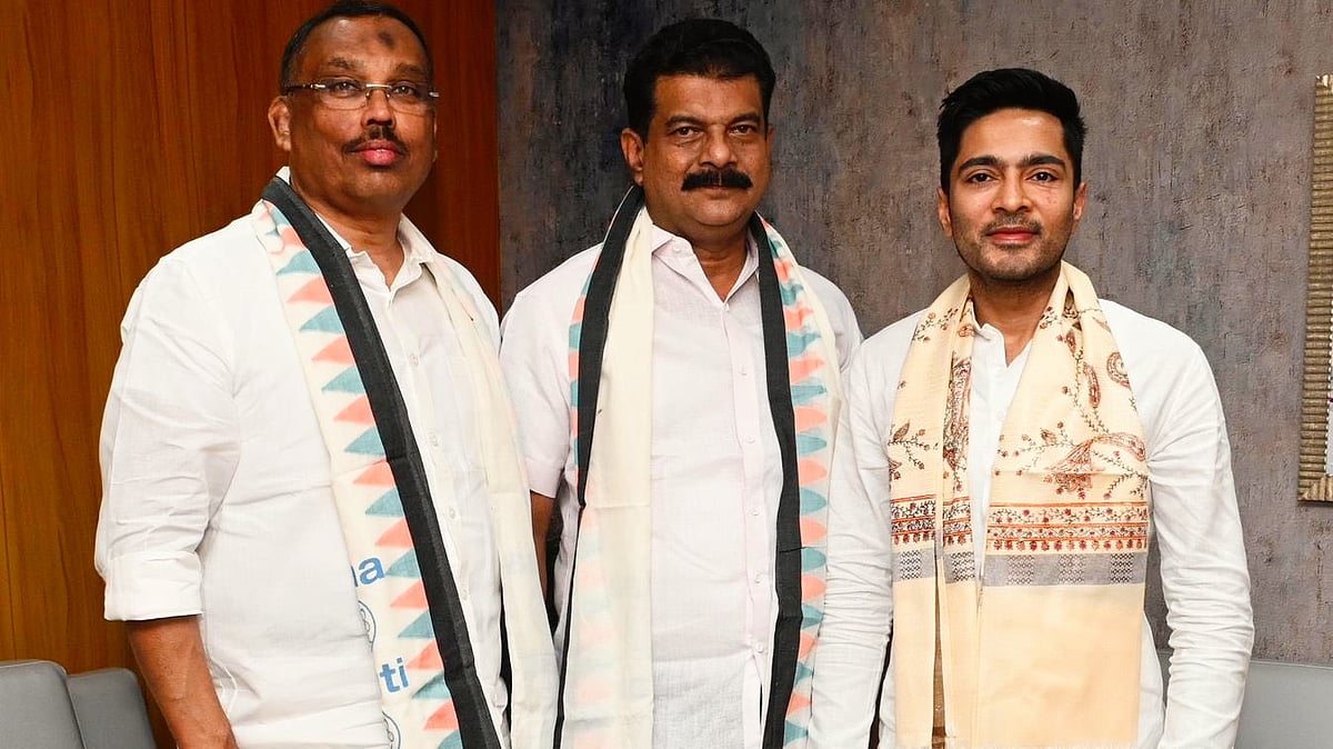 P.V. Anvar (centre) with Abhishek Banerjee (photo: @AITCofficial/X)