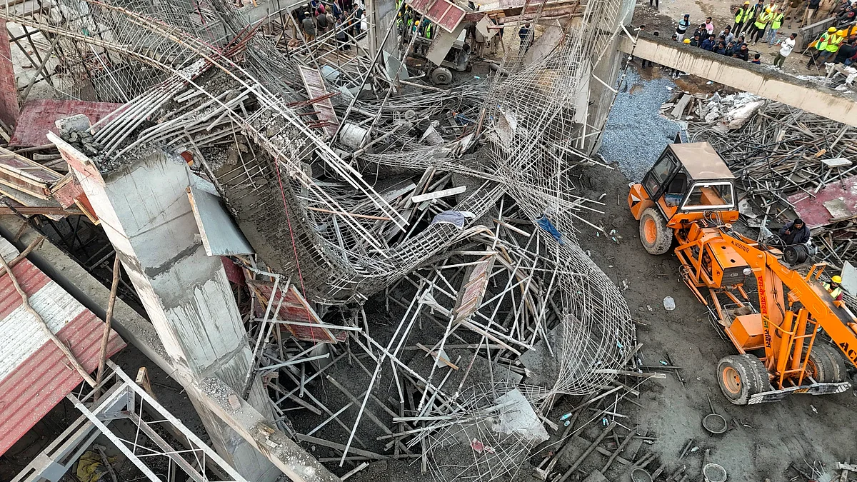 Rescue operation underway at Kannauj railway station on 12 January (photo: PTI)