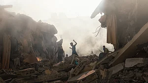 Children scamper through the rubble in Gaza