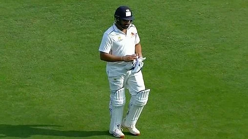 A disappointed Rohit Sharma walks back (photo: BCCI)