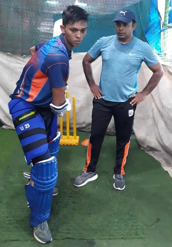 A younger Yashasvi with coach Jwala Singh