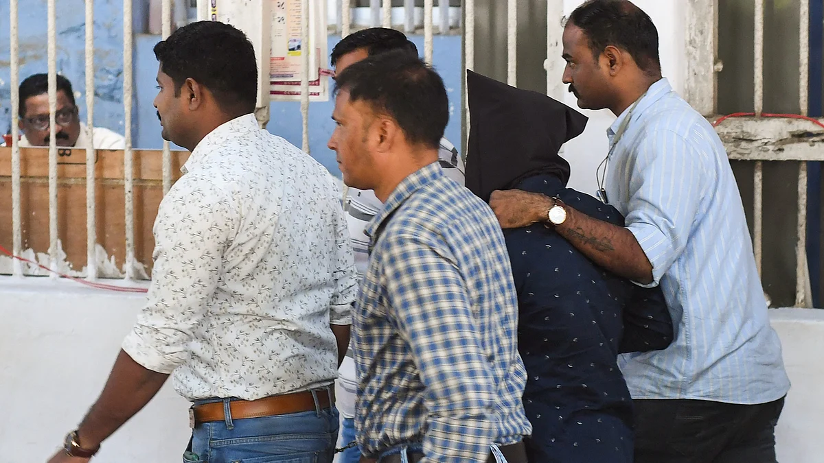The 'accused' being produced at a court in Mumbai on 24 January (photo: PTI)