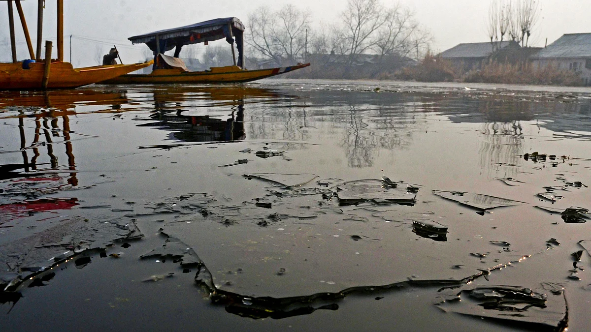 A partially frozen Dal Lake with sheets of ice visible on water (photo: IANS) 
