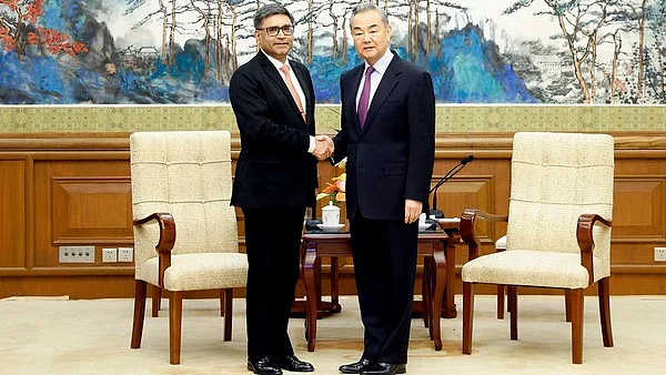 Chinese FM Wang Yi and India's foreign secretary Vikram Misri in Beijing on 27 January (photo: PTI)