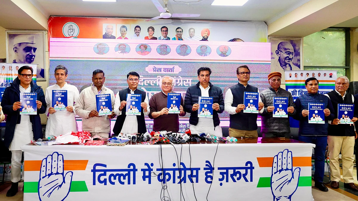 Jairam Ramesh (centre) with Devender Sharma (R) and Pawan Khera at the manifesto launch (photo: Vipin/NH)