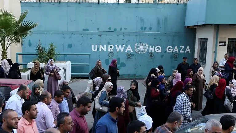 Refugees outside UNRWA 
headquarters (photo: IANS)