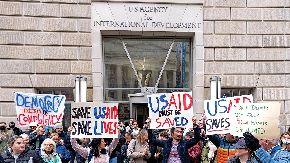 Employees and supporters protest against the proposed closure of USAID