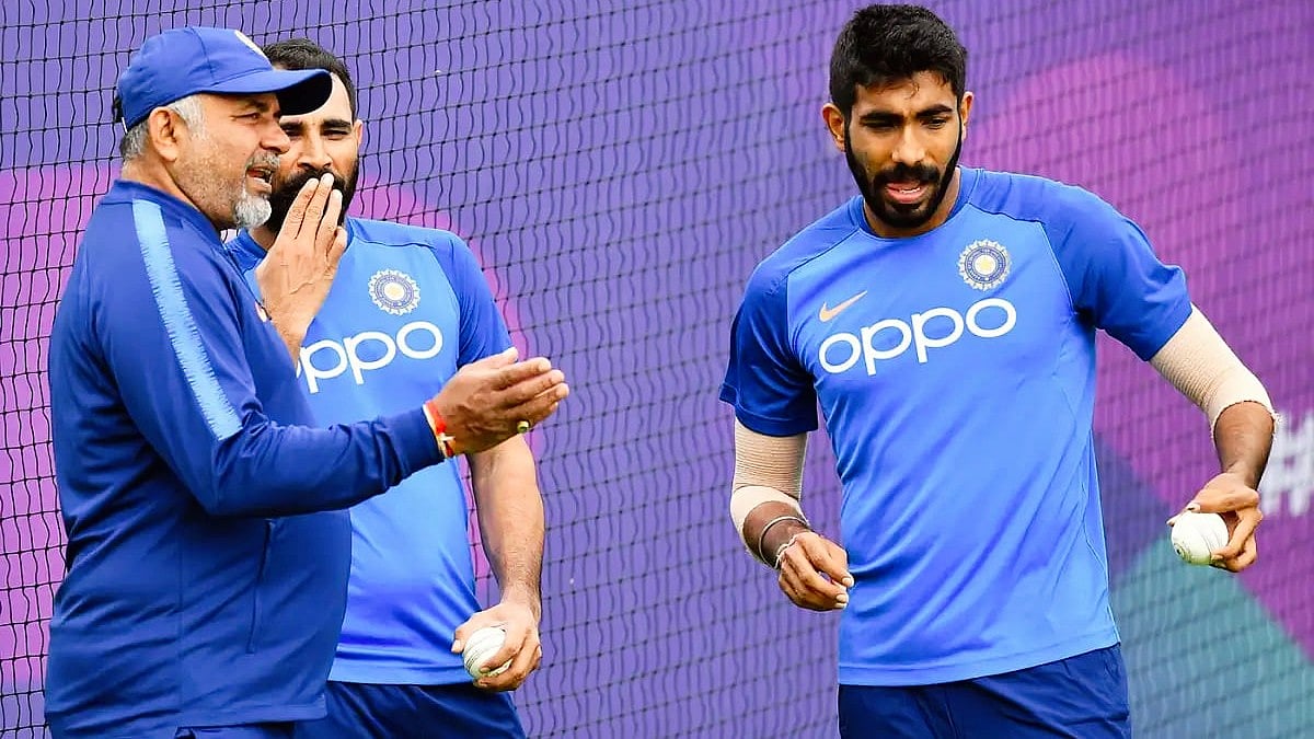 Bharath Arun (left) with Bumrah, Mohammed Shami during his tenure as bowling coach