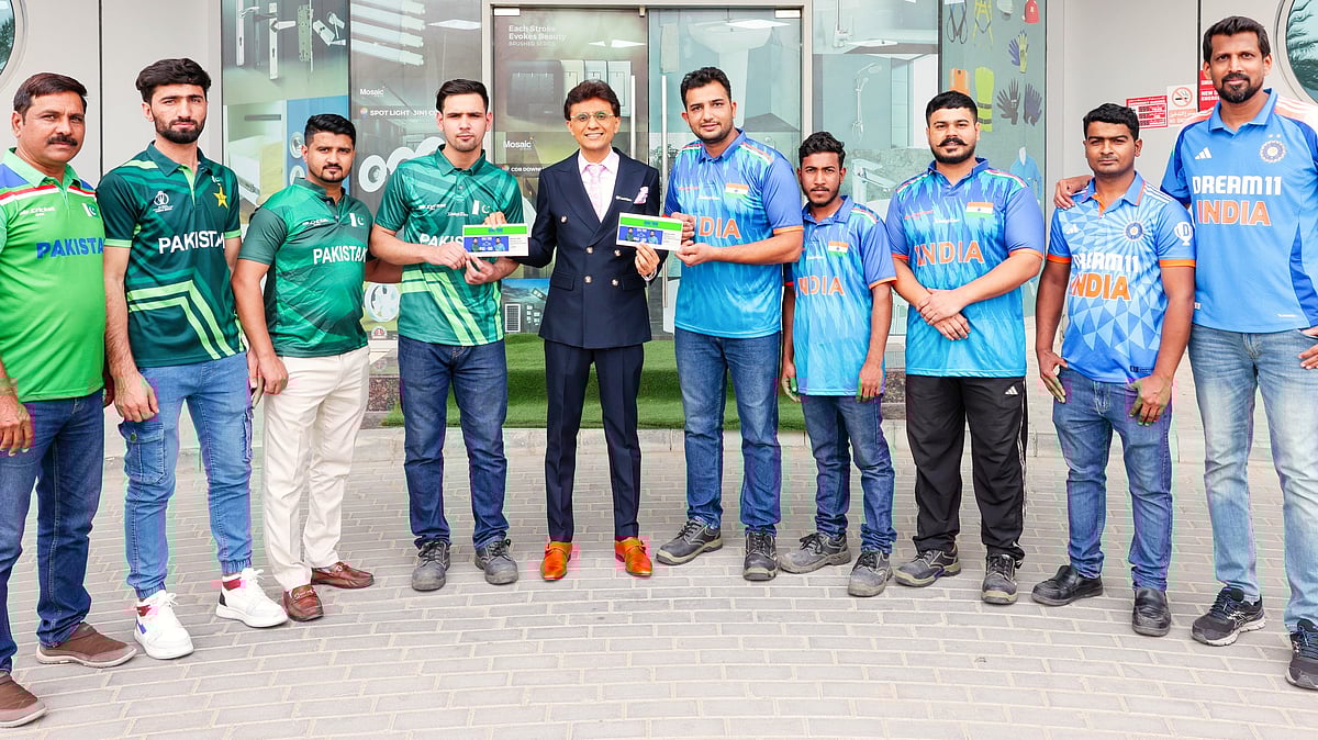 Danube Group employees pose with vice-chairman Anis Sajan in Dubai