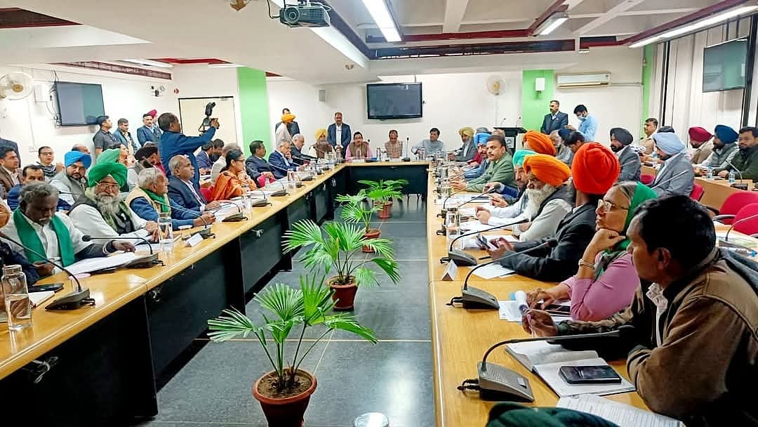 Shivraj Singh Chouhan and Pralhad Joshi during a meeting with farmer in Chandigarh (photo: PTI)