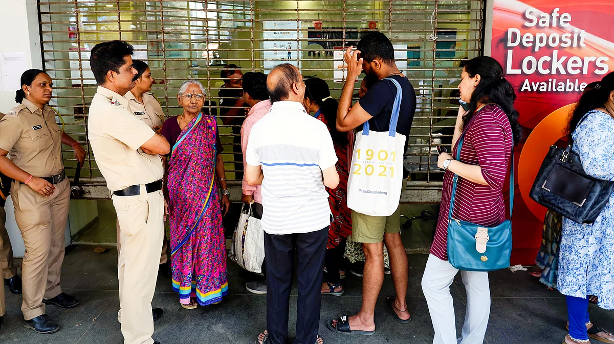 Anxious customers outside the bank on 15 February (photo: PTI)