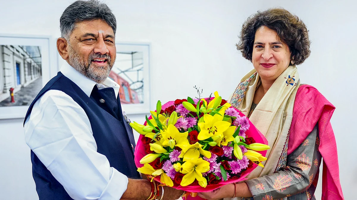 D.K. Shivakumar with Priyanka Gandhi Vadra (photo: PTI)