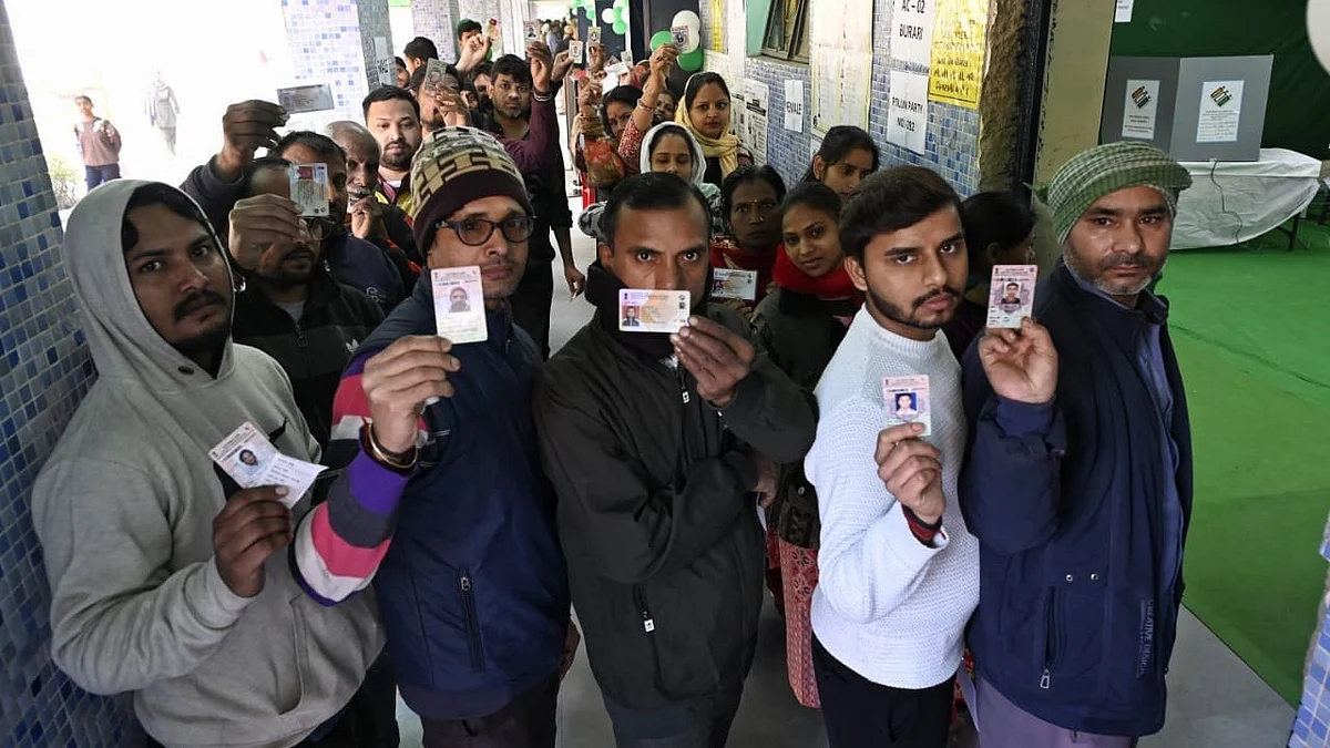 Voters queue up outside a polling booth in Delhi (photo: Vipin/NH)