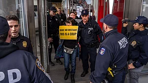 NYPD officers arrest demonstrators in New York on 2 March (photo: PTI)