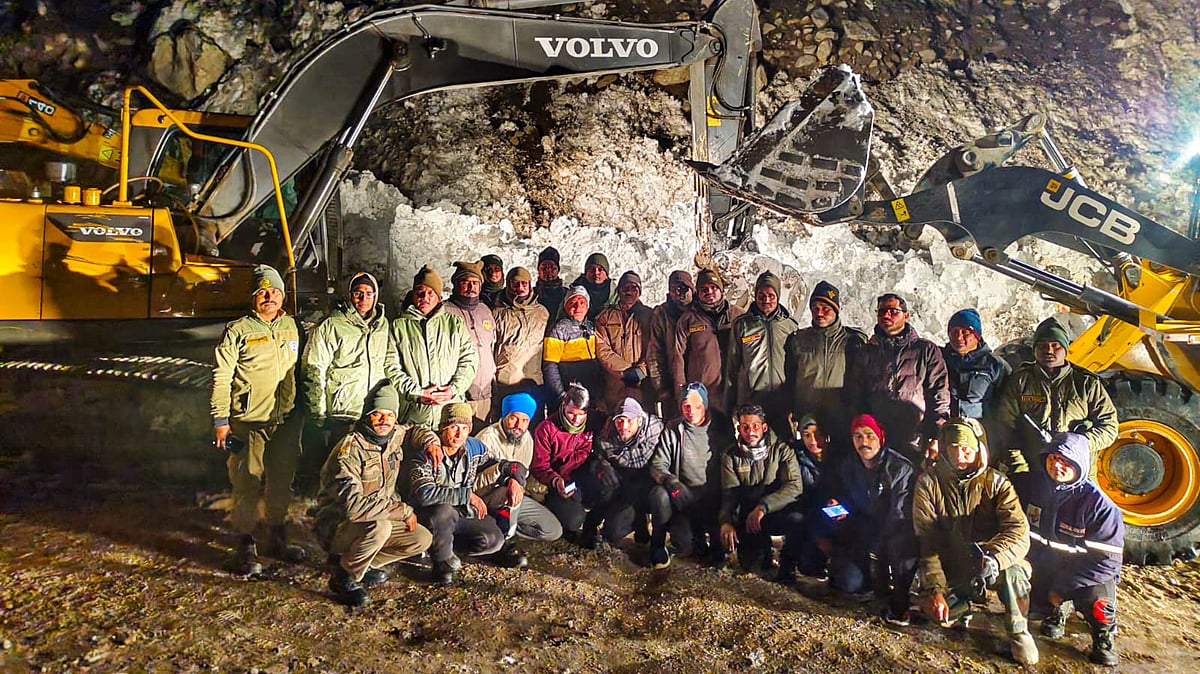 Rescue team members pose for a group photo in Chamoli (photo: PTI)