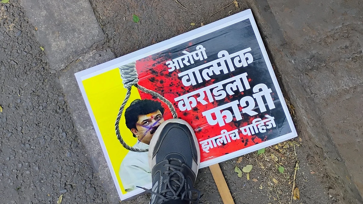 A poster demands Walmik Karad, aide to Dhananjay Munde, be hanged. The anger encompasses the MLA too