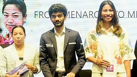 D. Gukesh flanked by Olympic medallists Mirabai Chanu (left) and Lovelina Borgohain
