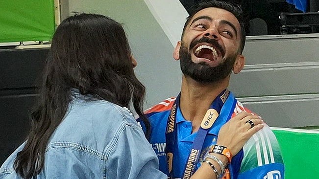 Virat Kohli celebrates with wife Anushka Sharma in Dubai (photo: PTI)