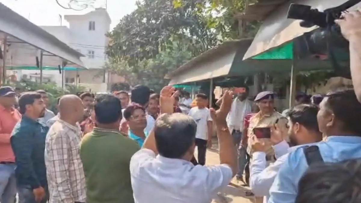People gather outside Chaitanya Baghel' residence during the ED raid (photo: PTI)