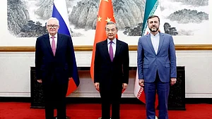 Wang Yi (centre) with Ryabkov Sergey Alexeevich and Kazem Gharibabadi (photo: @CHNMFA_DAC/X)