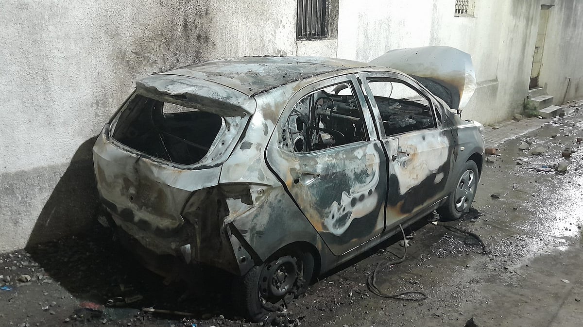 A charred vehicle in Nagpur 17 March (photo: PTI)