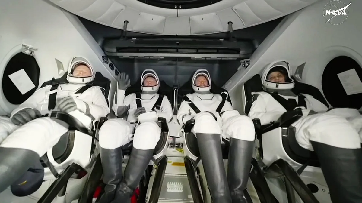 Sunita Williams (far right) with her fellow astronauts after their landing