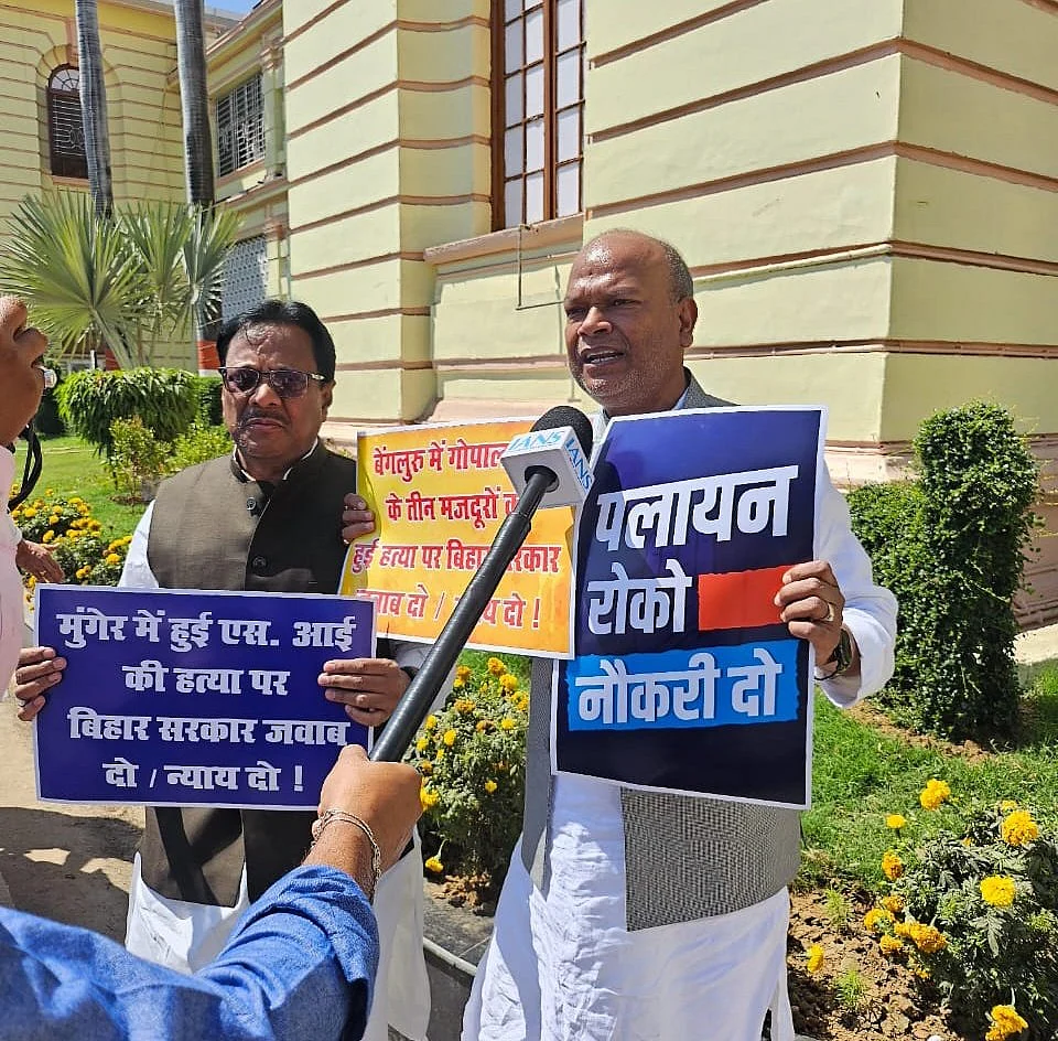 The new BPCC president holds up a 'Palayan roko, naukri do' poster