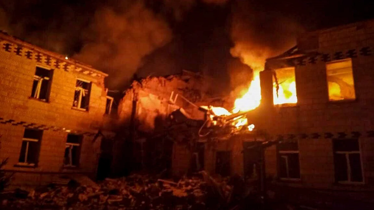 fire and smoke engulf a building after a Russian attack in Krasnopillia, Sumy region, Ukraine