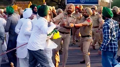 Farmers being detained by the police during a protest in Mohali (photo: PTI)