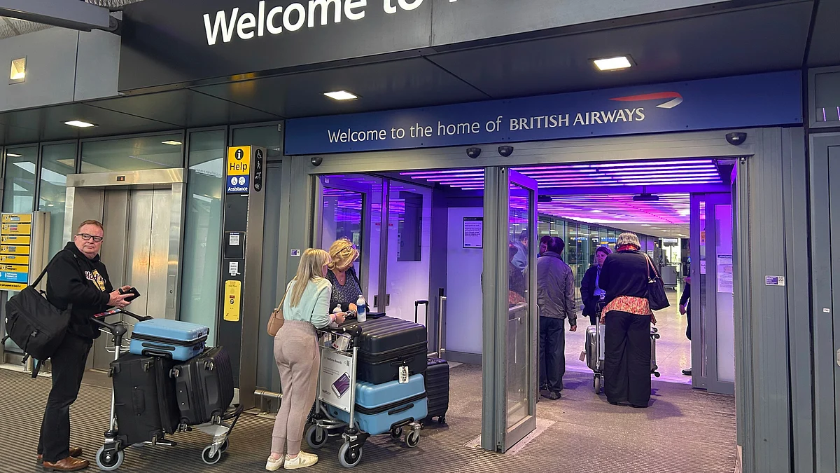 Passengers arrive at Heathrow Airport in London on 21 March (photo: AP/PTI)