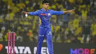 Vignesh Puthur celebrates one of his wickets on 23 March (photo: BCCI)